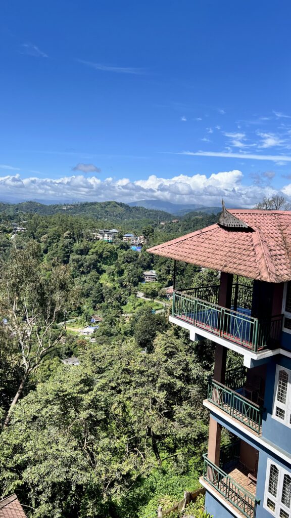Lazo Golden Valley Resort building set among trees above the Chithirapuram valley